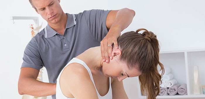 Woman receiving chiropractic adjustment from a Minnetonka chiropractor