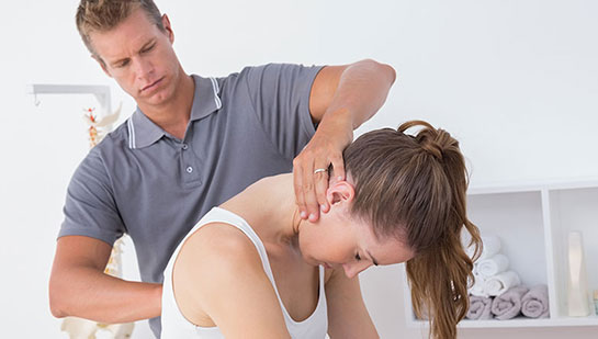 Woman receiving chiropractic adjustment from a Minnetonka chiropractor