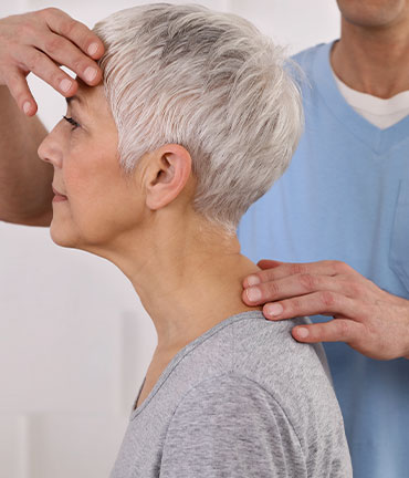 Patient receiving chiropractic adjusmtent for migraine relief from Minnetonka Chiropractors