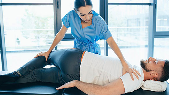 Patient receiving sciatica treatment from Minnetonka chiropractor